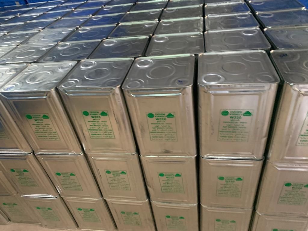 Stacked 10 kg tins of W320 cashew kernels
