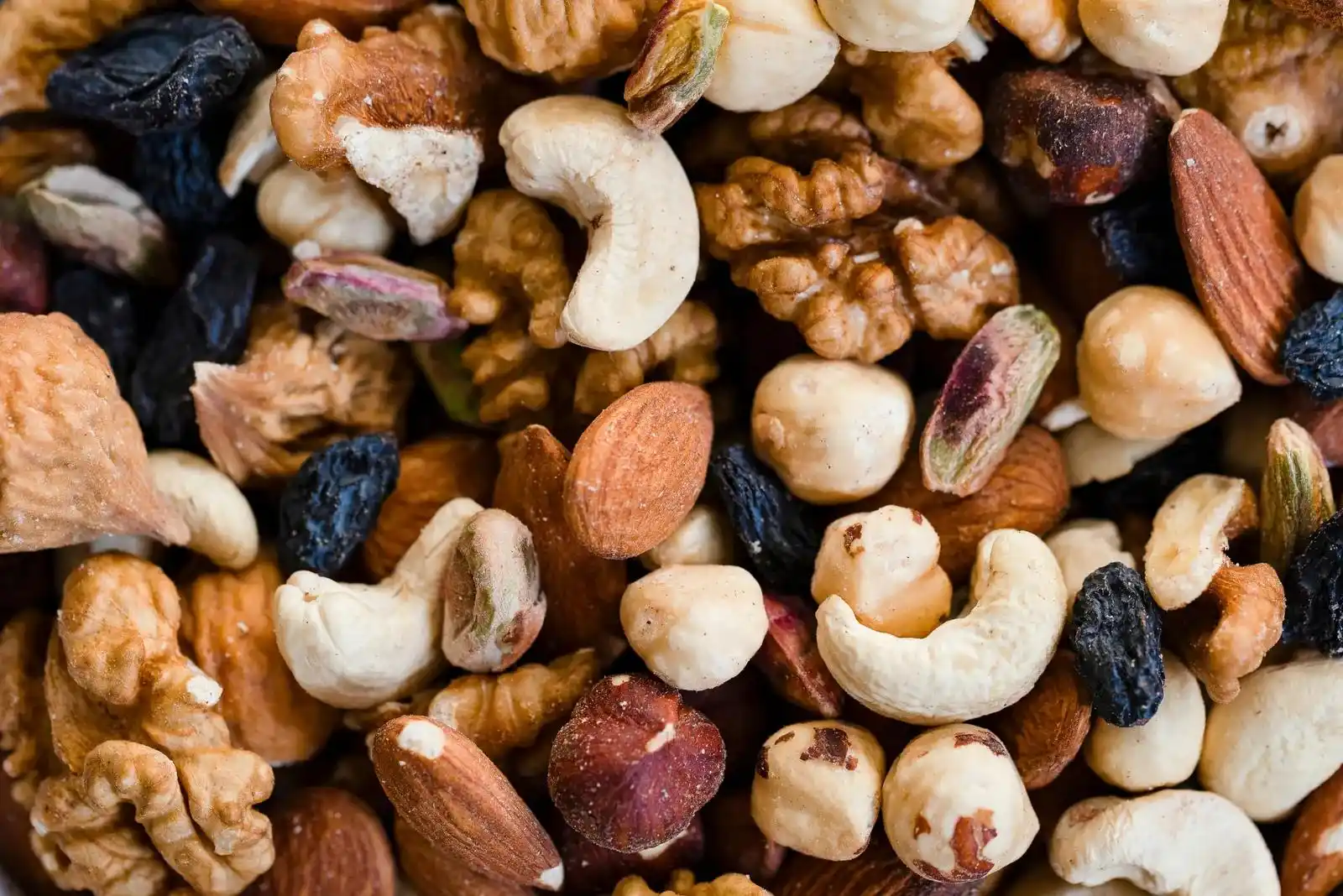 An assortment of cashews, almonds, walnuts, hazelnuts, pistachios and raisins
