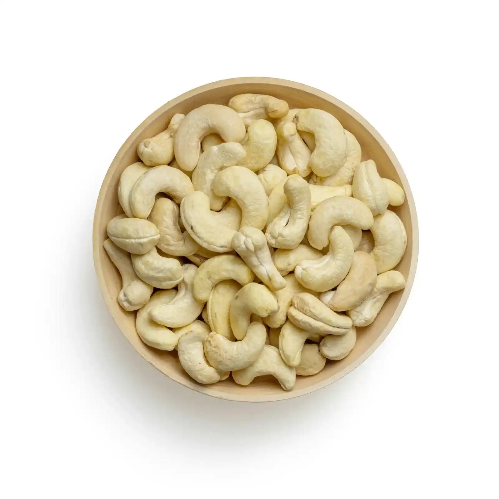Cashews in a wooden bowl on a white background